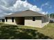 Rear view of house showcasing covered lanai at 7088 Sw 179Th Court Rd, Dunnellon, FL 34432