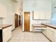 Kitchen with an island and access to hallway at 26 Juniper Pass Ln, Ocala, FL 34480