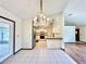 Bright dining area with tiled floor and access to the patio at 26 Juniper Pass Ln, Ocala, FL 34480