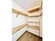 Well-organized closet with wooden shelves providing storage at 26 Juniper Pass Ln, Ocala, FL 34480