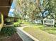 Large backyard with shed, garden area, and spacious lawn at 26 Juniper Pass Ln, Ocala, FL 34480