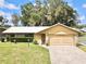 House exterior showcasing a metal roof and stone facade at 26 Juniper Pass Ln, Ocala, FL 34480