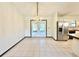 Dining room with tiled floors and a crystal chandelier at 26 Juniper Pass Ln, Ocala, FL 34480