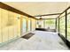 Screened-in porch with ceiling fan and door access at 26 Juniper Pass Ln, Ocala, FL 34480