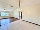 Dining room with tiled floors and a crystal chandelier at 26 Juniper Pass Ln, Ocala, FL 34480
