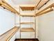 Walk-in closet with wooden shelves and hanging rods at 26 Juniper Pass Ln, Ocala, FL 34480
