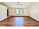 Living room with wood-look floors and a ceiling fan at 26 Juniper Pass Ln, Ocala, FL 34480