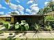 Screened-in porch with large plants and a walkway at 26 Juniper Pass Ln, Ocala, FL 34480