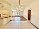Dining area with chandelier and view into living room at 26 Juniper Pass Ln, Ocala, FL 34480