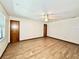 Bright bedroom featuring wood-look floors and ample space at 26 Juniper Pass Ln, Ocala, FL 34480