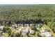 Aerial view of a residential community nestled in a lush forest setting at 11696 Sw 71St Cir, Ocala, FL 34476
