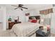 Well-lit bedroom featuring a wooden headboard and ample space at 11696 Sw 71St Cir, Ocala, FL 34476