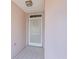 Front entry with screen door and tiled floor at 11696 Sw 71St Cir, Ocala, FL 34476
