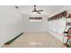 Bright game room with tile flooring, large windows, and a ceiling fan at 11696 Sw 71St Cir, Ocala, FL 34476