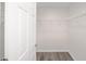 Large walk-in closet with wire shelving and vinyl flooring at 24381 Nw Falcon Ave, Dunnellon, FL 34432