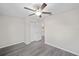 Spacious bedroom with ceiling fan and vinyl flooring at 24381 Nw Falcon Ave, Dunnellon, FL 34432