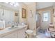 Clean bathroom with tub/shower combo, toilet, and vanity at 10716 Sw 53Rd Cir, Ocala, FL 34476
