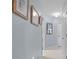 Light and airy hallway with neutral walls and tiled floors at 10716 Sw 53Rd Cir, Ocala, FL 34476