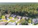 Aerial view of neighborhood homes nestled in a wooded area at 11696 Sw 71St Cir, Ocala, FL 34476