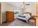 Bedroom with wood furniture and window overlooking the backyard at 174 Juniper Trl, Ocala, FL 34480
