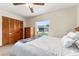 Bright bedroom with a view, ceiling fan, and built-in closet at 174 Juniper Trl, Ocala, FL 34480