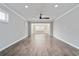 Hardwood floors and neutral color palette in this large living room at 7823 Sw 97Th Cir, Ocala, FL 34481