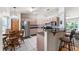 Kitchen with stainless steel appliances, breakfast bar, and adjacent dining area at 174 Juniper Trl, Ocala, FL 34480