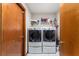Laundry room with washer, dryer, and shelving at 174 Juniper Trl, Ocala, FL 34480