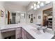 Double vanity bathroom with large mirror and access to bedroom at 174 Juniper Trl, Ocala, FL 34480