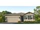 One-story home with two-car garage and landscaped yard at 9345 Sw 60Th Court Rd, Ocala, FL 34476