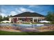 Community pool with lounge chairs and umbrellas at 9342 Sw 60Th Court Rd, Ocala, FL 34476