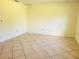 Bright bedroom with neutral walls and tile flooring at 8424 Sw 107Th Pl, Ocala, FL 34481
