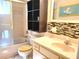 Bathroom with shower/tub combo, vanity, and tile flooring at 8424 Sw 107Th Pl, Ocala, FL 34481