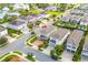 Aerial view of house and community, including pool and playground at 7694 Graben St, Kissimmee, FL 34747
