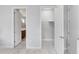 Bedroom with access to bathroom and walk-in closet at 7694 Graben St, Kissimmee, FL 34747