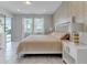 King bedroom with sliding doors leading to the backyard and a neutral color palette at 7694 Graben St, Kissimmee, FL 34747