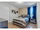 Bedroom with gray walls and wood floors at 7694 Graben St, Kissimmee, FL 34747
