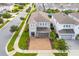 Two-story house with driveway and landscaping at 7694 Graben St, Kissimmee, FL 34747