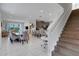 Open concept dining room with large table and access to kitchen at 7694 Graben St, Kissimmee, FL 34747