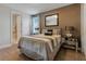 Bedroom with wood floors and a view of the bathroom at 7694 Graben St, Kissimmee, FL 34747