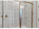 Large walk-in shower with marble tile and gold fixtures at 7694 Graben St, Kissimmee, FL 34747