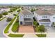 Aerial view of house, driveway, and surrounding neighborhood at 7694 Graben St, Kissimmee, FL 34747
