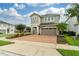 Two-story house with driveway and landscaping at 7694 Graben St, Kissimmee, FL 34747