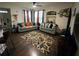 Living room with two sofas, a rug, and wood flooring at 3396 Parkchester Square Blvd # 103, Orlando, FL 32835