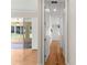 Bright hallway with hardwood floors leading to bedrooms at 9823 Sw 95Th Loop, Ocala, FL 34481