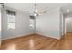 Bright bedroom with hardwood floors and two windows at 9823 Sw 95Th Loop, Ocala, FL 34481