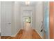 Hardwood floors and view into living room from entry at 9823 Sw 95Th Loop, Ocala, FL 34481