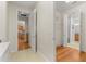 Laundry room with washer, dryer, cabinets, and kitchen access at 9823 Sw 95Th Loop, Ocala, FL 34481