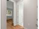 Bright hallway with hardwood floors and access to other rooms at 9823 Sw 95Th Loop, Ocala, FL 34481