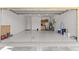 Garage with workshop area and extra storage space at 9823 Sw 95Th Loop, Ocala, FL 34481